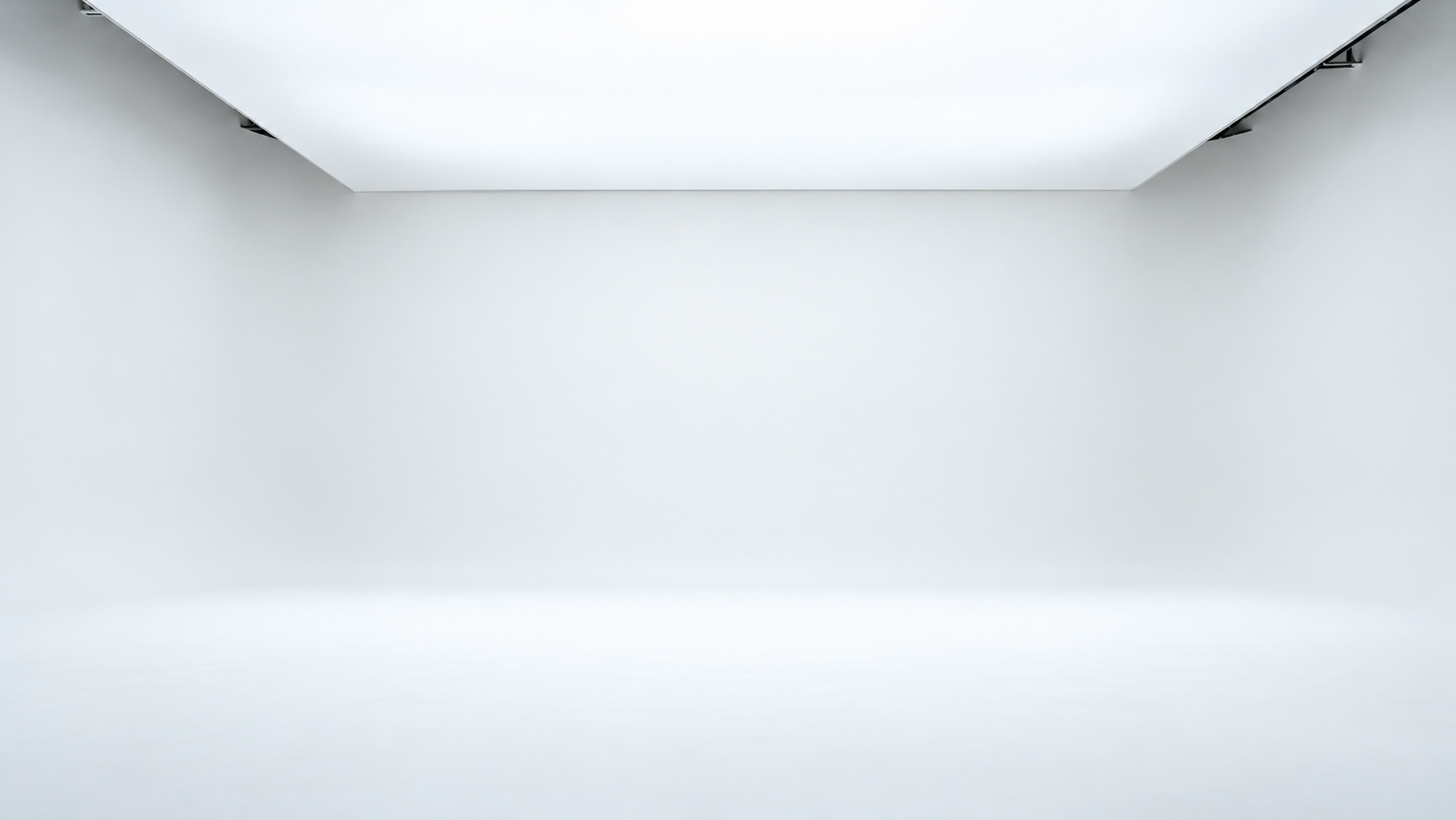 Studio putih minimalis dengan panel lampu di plafon
